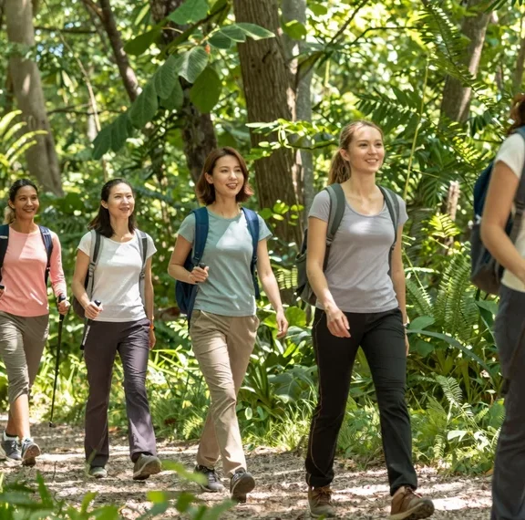 Hiking Trousers for Ladies That Don't Feel Like Canvas Sacks 8 A group of happy women wearing hiking trousers for ladies, enjoying a day out in nature.